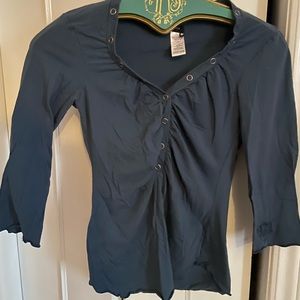 Cute top. It is a medium but it runs small